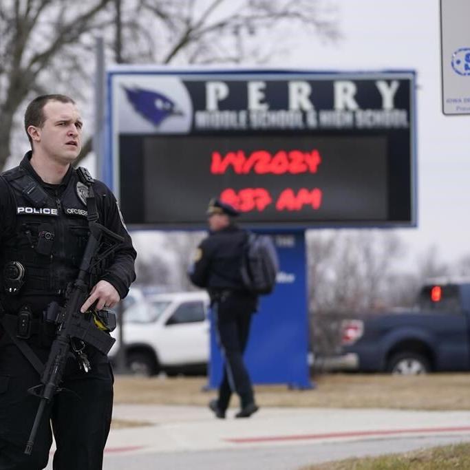 Iowa principal critically injured in school shooting risked himself to protect students, police say